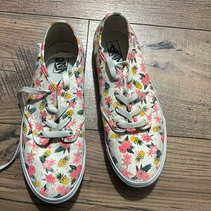A pair of floral Vans